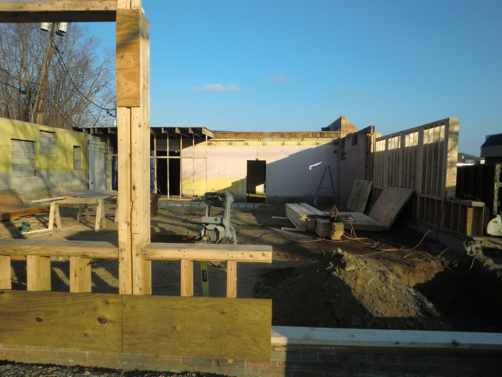 The roof has been removed and little remains of the existing storefront building