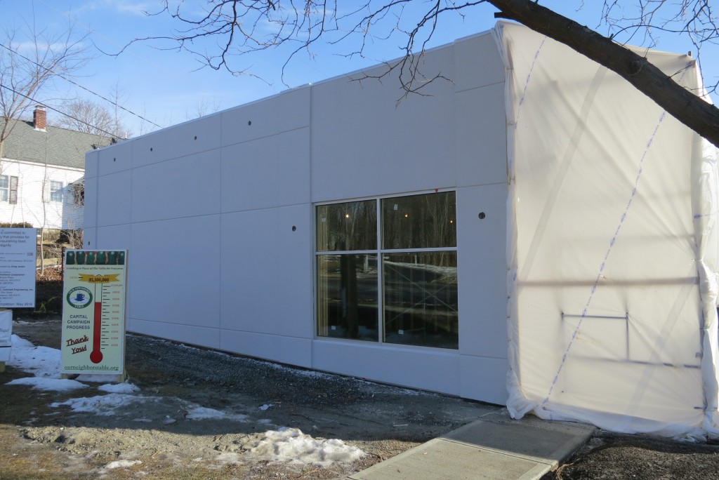 Exterior Insulation Finishing System (EFIS) and aluminum storefront window installation