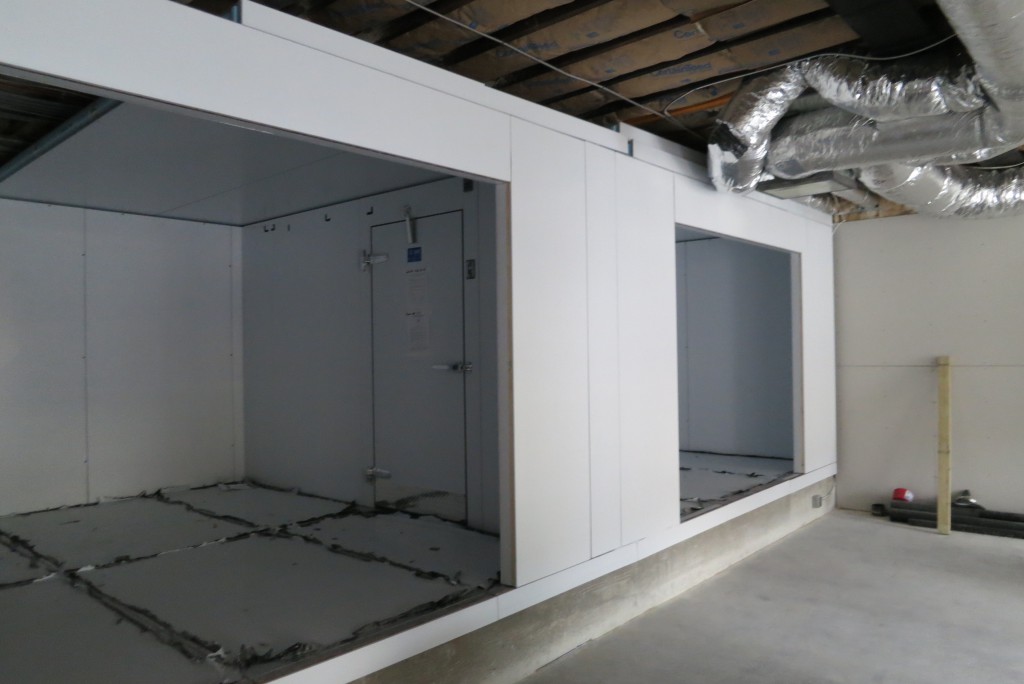 The panelized walk-in refrigeration assembly is in process after gypsum wall board installation.